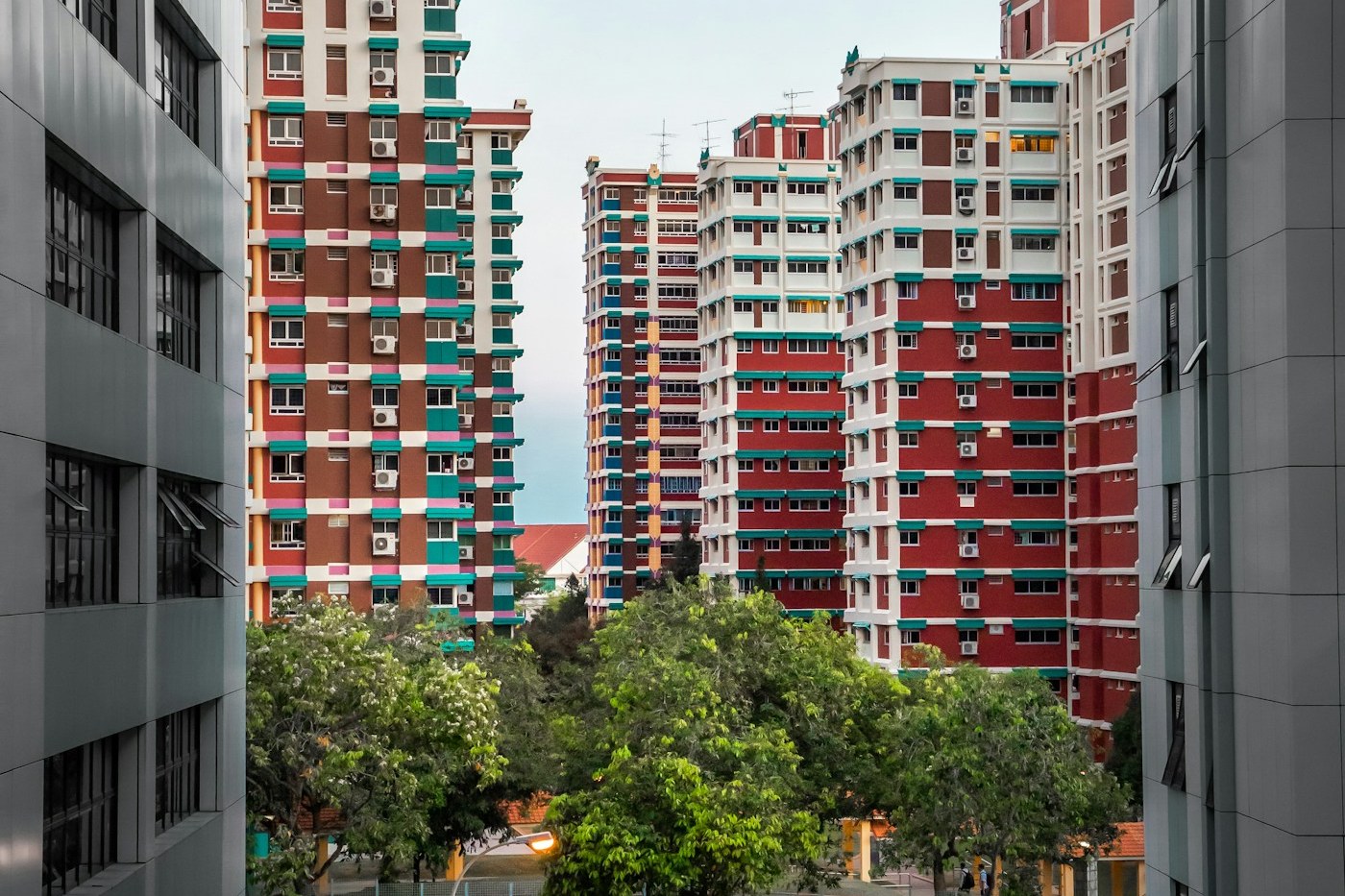 Jurong West HDB blocks at dusk with warm windows lit